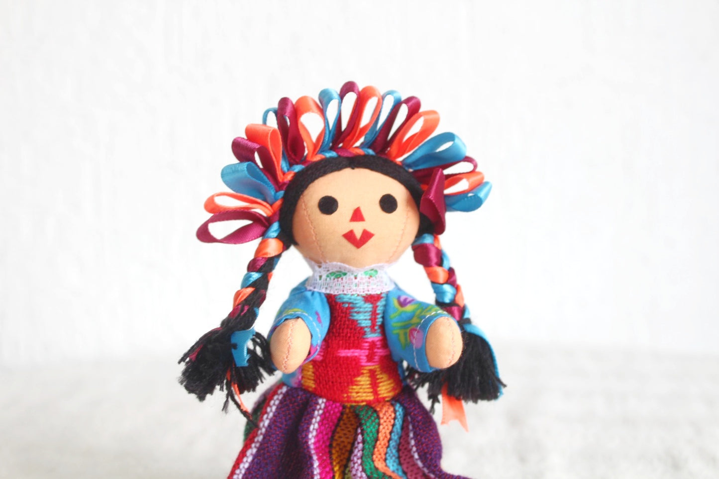 Muñeca Lelé Pequeña Azul Naranja Vino